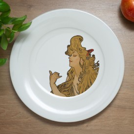 White plate with an Art Nouveau-style illustration of a woman in profile