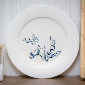 White plate with a blue butterfly pattern illustration