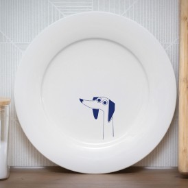 White plate with a minimalist blue dog illustration