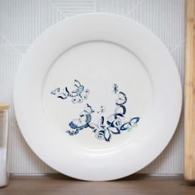 White plate with a blue butterfly pattern illustration