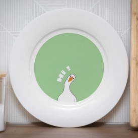 White plate with an illustration of a goose saying 'Hi'